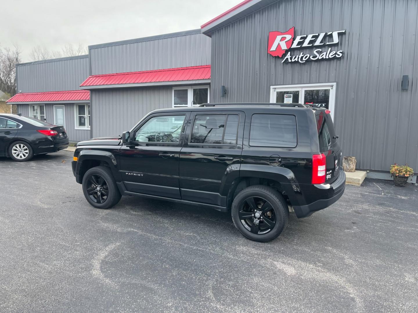 2017 Black /Black Jeep Patriot Latitude 4WD (1C4NJRFB5HD) with an 2.4L I4 DOHC 16V engine, 6-Speed Automatic transmission, located at 11115 Chardon Rd. , Chardon, OH, 44024, (440) 214-9705, 41.580246, -81.241943 - This 2017 Jeep Patriot Latitude with 4WD and only 55,000 miles on the odometer. This SUV comes equipped with a 2.4L engine for powerful performance. It features a comfortable and spacious interior with modern amenities. The 4WD capability ensures that you can handle any terrain or weather conditions - Photo#13